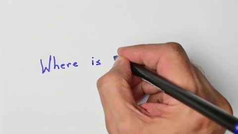 Writing with a blue marker the sentence: Where is the bathroom Stock Footage 221781101