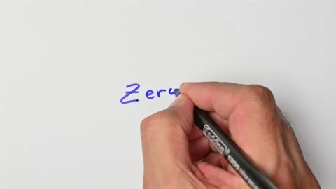 Writing with a blue marker the sentence: Zero Stock Footage 221783831