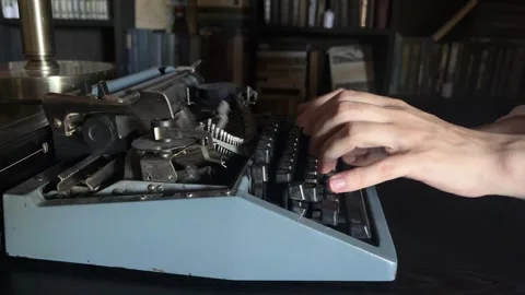 Writing a book and typing old typewriter, side view. Human hands are typing on Stock Footage 346689137