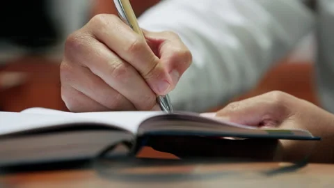 Writing in book Stock Footage 340844593