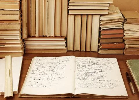 Writing-book with mathematical problems Stock Photos