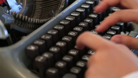 Writing a book on an old typewriter Stock Footage 338028420