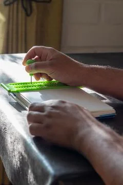 Writing in Braille in a notebook Stock Photos
