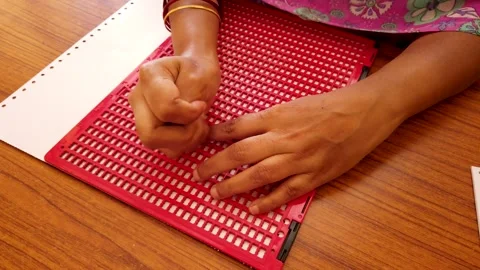 Writing a Braille script for the Visually impaired people in India. Stock Footage 248401627