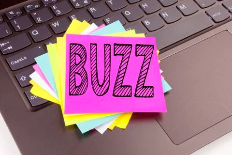 Writing Buzz text made in the office close-up on laptop computer keyboard. Bu Stock Photos