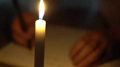 Writing by candle light at night Stock Footage 156281120