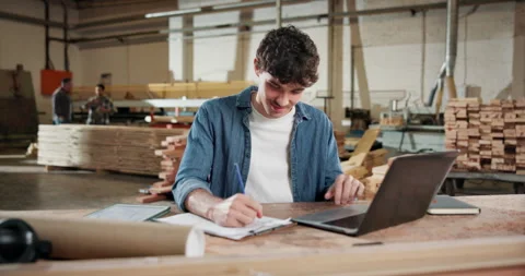 Writing, carpenter and laptop with man in workshop for contractor, woodworking Video stock 338315778
