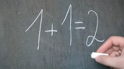 Writing in chalk on a blackboard. Math lesson. Stock Footage 113631593