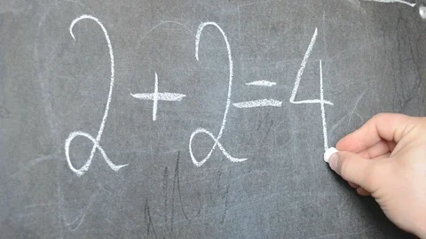 Writing in chalk on a blackboard. Math lesson. Stock Footage 113690907