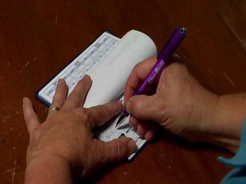 Writing a check Stock Footage 12425081