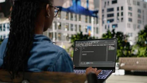Writing code on laptop, implementing programming language, software developer Stockfoto's