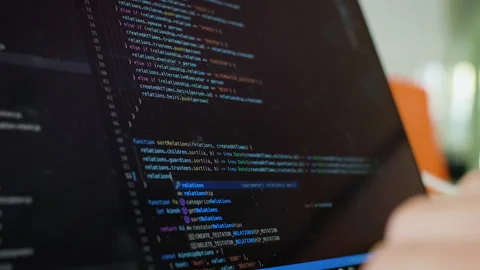 Writing code on laptop. Software Developer writes code from home. Remote Stock Footage 130375154