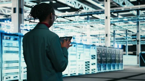 Writing code, tablet and female programmer walking in data center 스톡 동영상 329945566