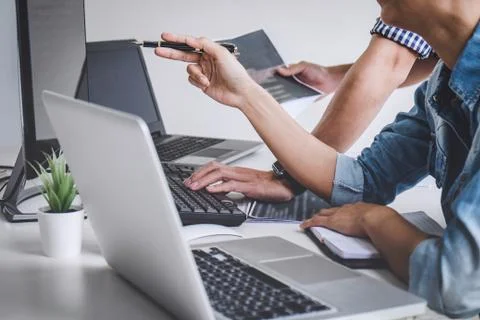 Writing codes and typing data code technology, Programmer cooperating working Stock Photos