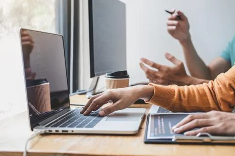 Writing codes and typing data code technology, Programmer cooperating working Stock-Fotos