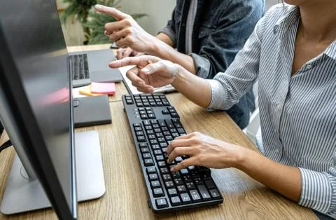 Writing codes and typing data code technology, Programmer team working on web Foto stock