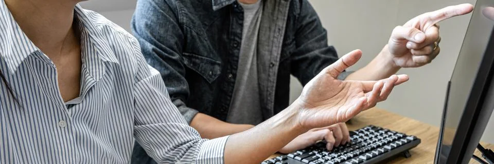 Writing codes and typing data code technology, Programmer team working on web Foto stock