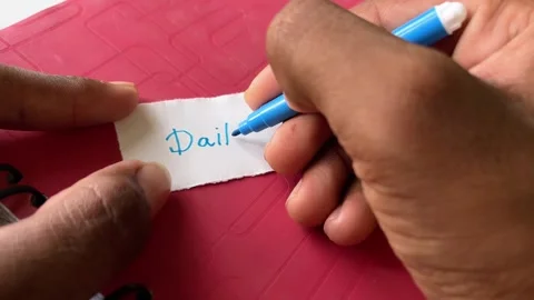 Writing “Daily Plan” on Notebook Page with Pen | Productivity and Routine Видео 320386959
