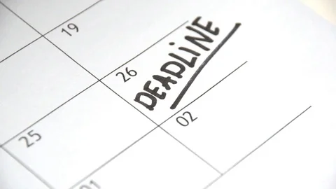 Writing DEADLINE on calendar with a black marker Stock Footage 80368528