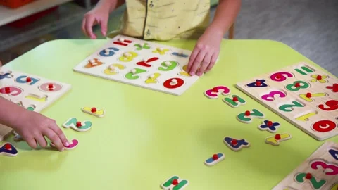 A writing desk on which there are numbers with math tasks. Solving problems i Stock Footage 158385828