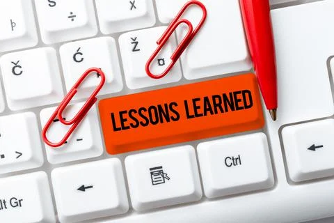 Writing displaying text Lessons LearnedPromote share and use knowledge derived Stock Photos