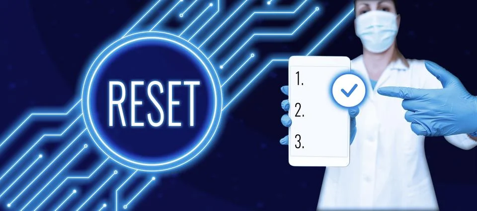 Writing displaying text Reset. Concept meaning cause device return to its 库存照片