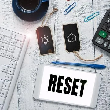 Writing displaying text Reset. Word for cause device return to its factory mode 库存照片