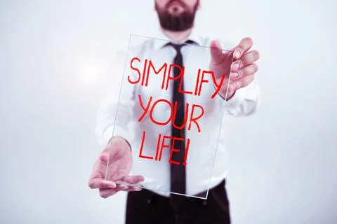 Writing displaying text Simplify Your Life. Concept meaning focused on important Stock Photos
