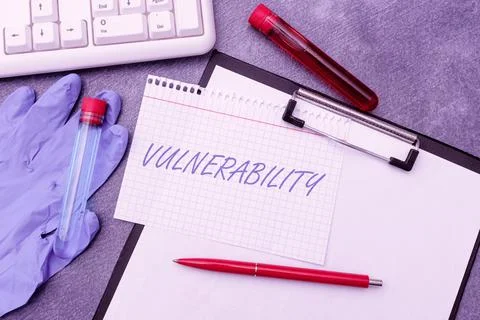 Writing displaying text Vulnerability. Word Written on State of being exposed to Stock Photos