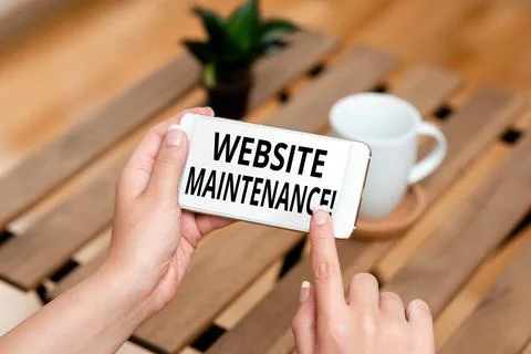 Writing displaying text Website Maintenance. Business idea act of regularly Stock-Fotos