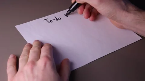 Writing "To-do today" on a piece of paper Stock Footage 147137851