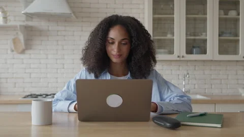 Writing Email While Humming, Calm Woman Working From Kitchen With Coffee Nearby Stock Footage 306696198