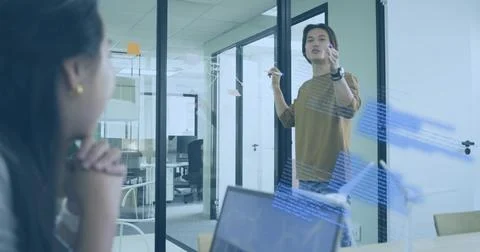 Writing engineer coding diagrams on glass board in meeting room, with markers Stock Photos