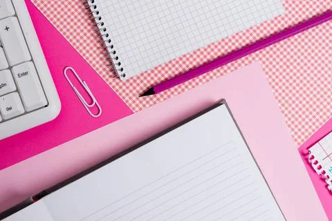 Writing equipments and computer stuffs plus mathematic paper placed on a c... Stock Photos