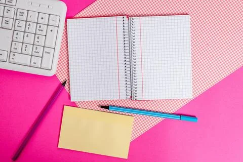Writing equipments and computer stuffs plus mathematic paper placed on a c... Stock Photos