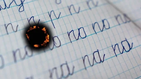 Writing with fire effects on paper in a creative project Stock Footage 342831511