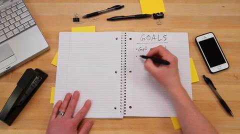 Writing goals in notebook, top view Stock Footage 34477582