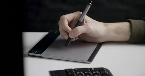 Writing on a graphic tablet with a pen Video stock 104603610