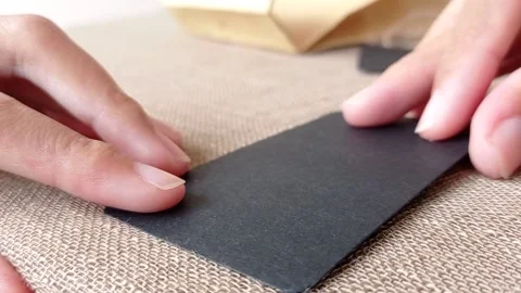 Writing a greeting card for a gift Stock Footage 146246342