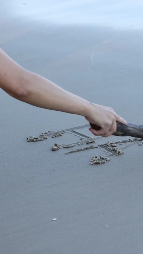 Writing \"Happy\"" in Sand Over Time" Stock Footage 304949882