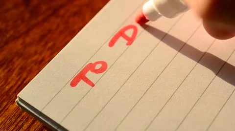 Writing header of TO DO LIST in notebook with marker Stock Footage 62812642