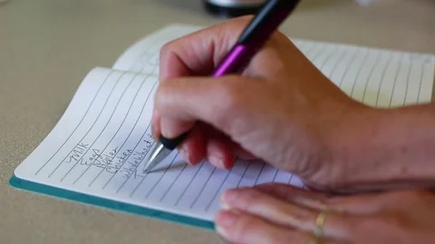 Writing a healthy grocery list Stock Footage