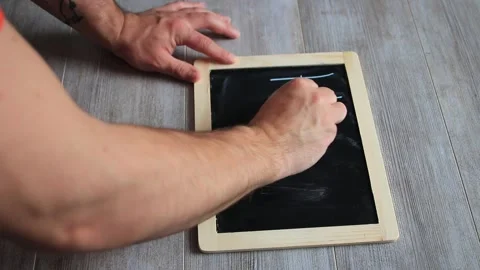 Writing help on a blackboard Stock Footage 147044026