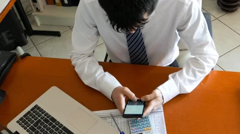 Writing on his cell phone at work Stock Footage 60696465
