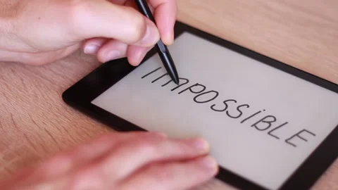 Writing IMPOSSIBLE on electronic tablet Stock Footage 166210211