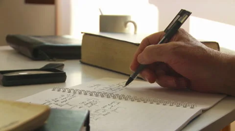 Writing a journal or notes at a desk. Stock Footage 41993574