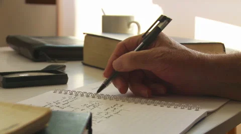 Writing a journal or notes at a desk. Stock Footage 41995375