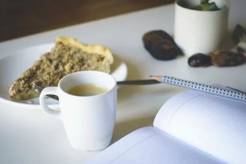 Writing a journal while having coffee and cake Stock Photos