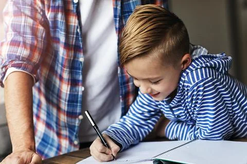 Writing, kid or parent help with homework in home for study support, litera.. Stock Photos