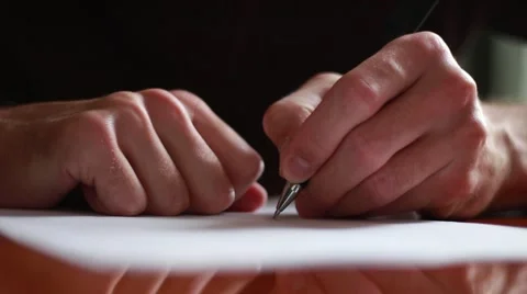 Writing a letter with left hand Vídeos de archivo 63454745